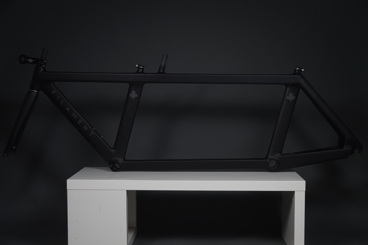 Side profile view of a Filament aero triathlon bike highlighting the custom geometry of the frame benefitting both stoker and pilot.