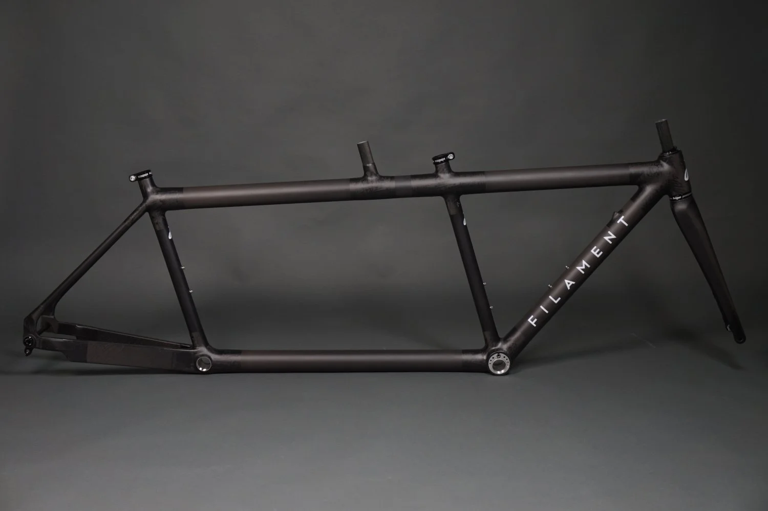 A custom carbon road tandem bike from Filament Bikes with Hope headset.