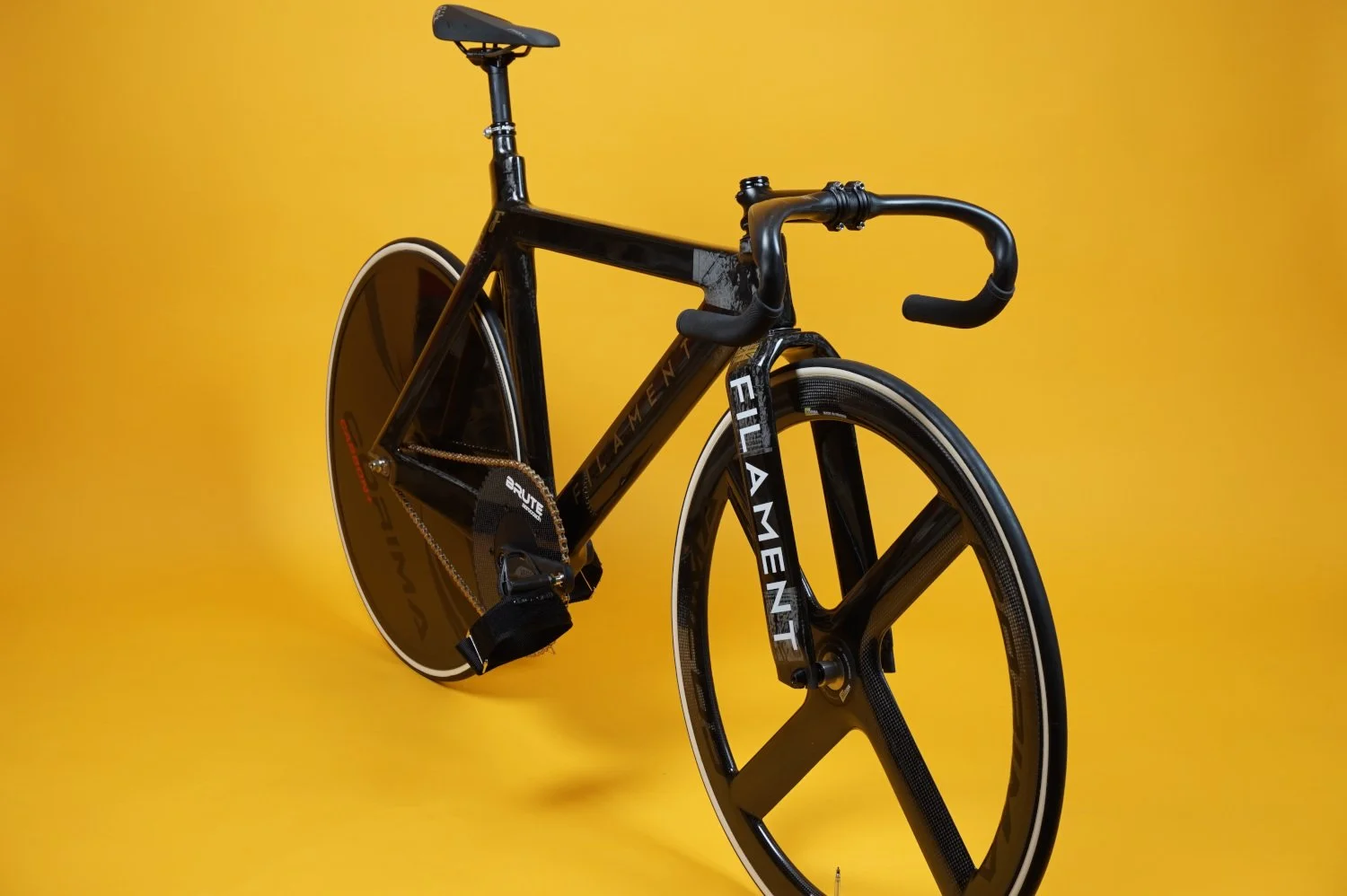 Filament's custom carbon fibre track frame and fork assembled with AeroCoach chain ring and Corima track wheels.