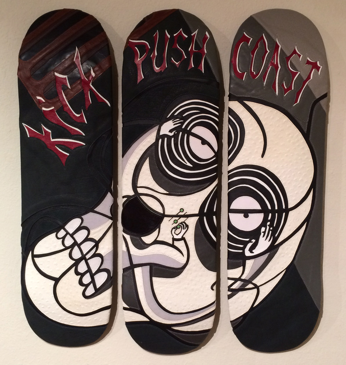 Leather and thread on three wood skateboard decks