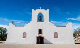 The facade of the Socorro Mission gives the illusion of a prop but walking through the doors reveals the depth and length of this old mission church.