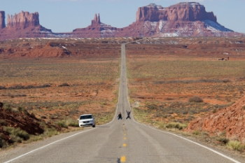 A couple takes a selfie along the famous Rt. 163 into Monument Valley, Arizona. Road trips like this are a great excuse for taking lots of family pictures and fun selfless.