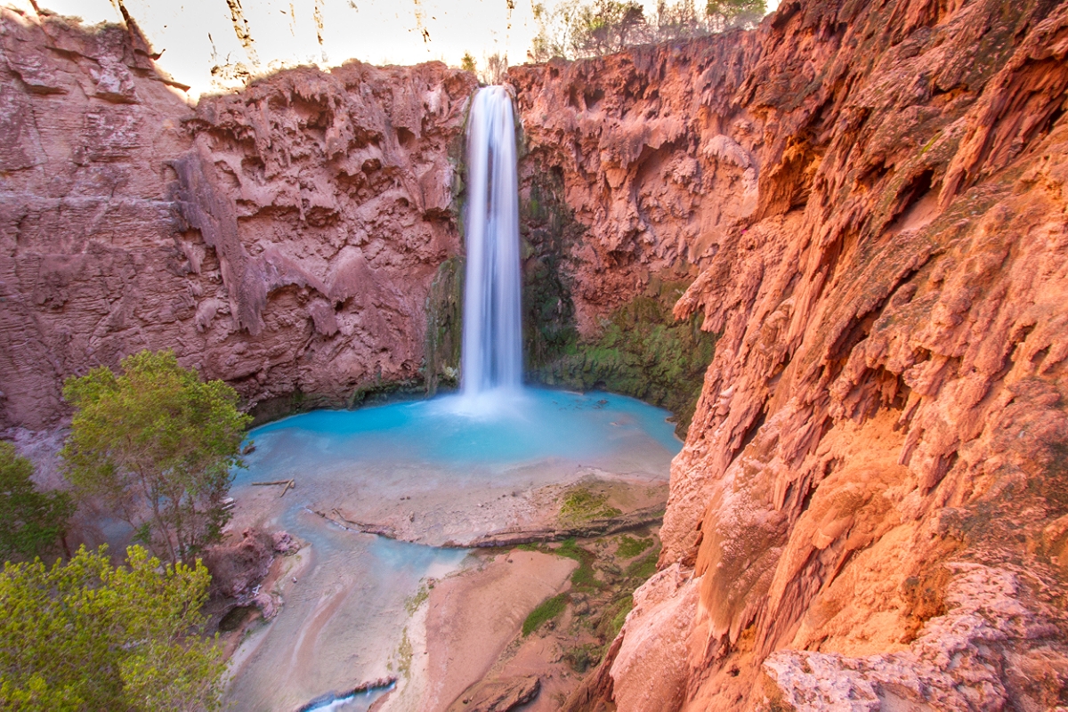 The base of Mooney Falls is riddled with lush greenery at every turn. It's really gorgeous!