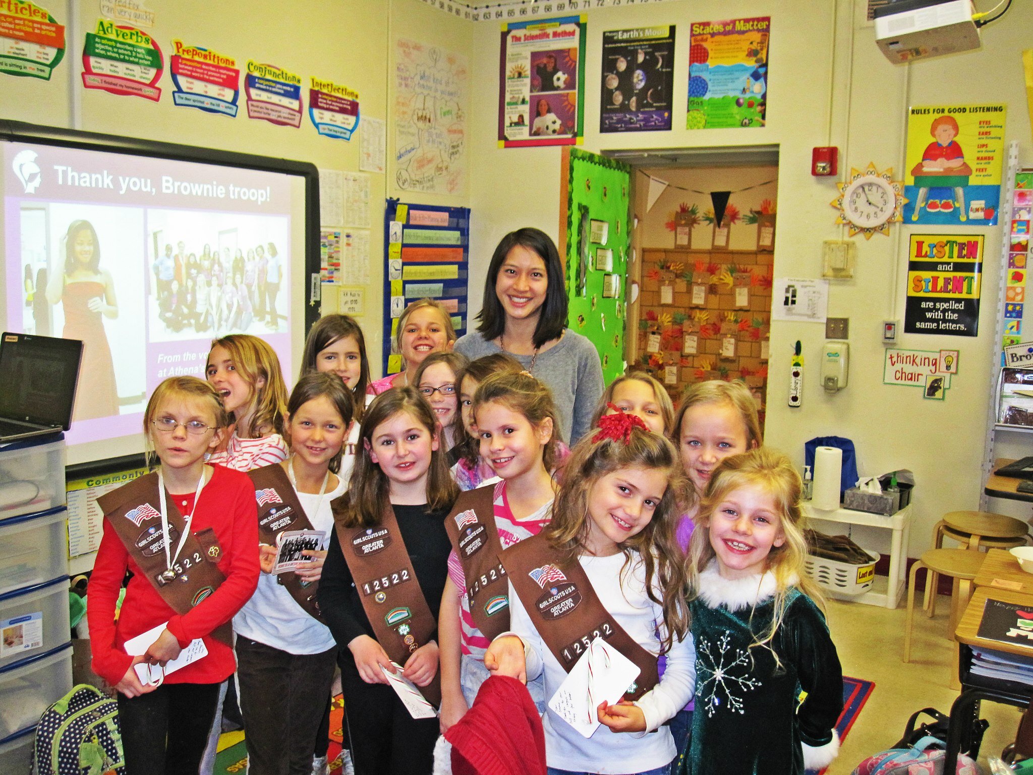 Morningside Elementary Brownie Troop earning their celebrating community badge by collecting prom dresses for AW.jpg