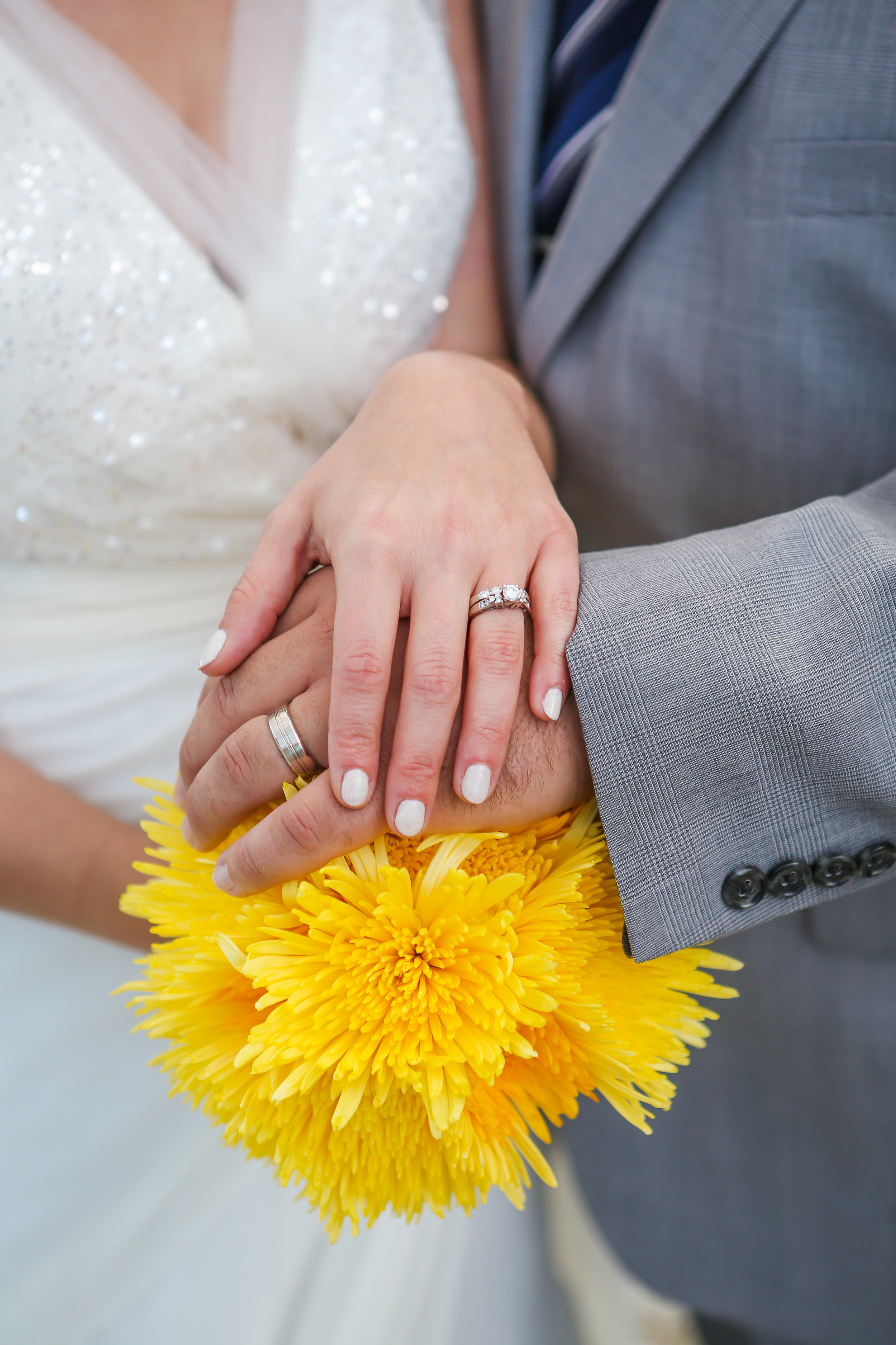 "Kyle works at Jared The Galleria of Jewelry and found the perfect engagement ring for me based on a simple drawing I did for him once. It is the sparkly-est diamond I've ever seen! And the wedding band is a perfect match. Kyle's wedding band is very simple and timeless-just like him!"