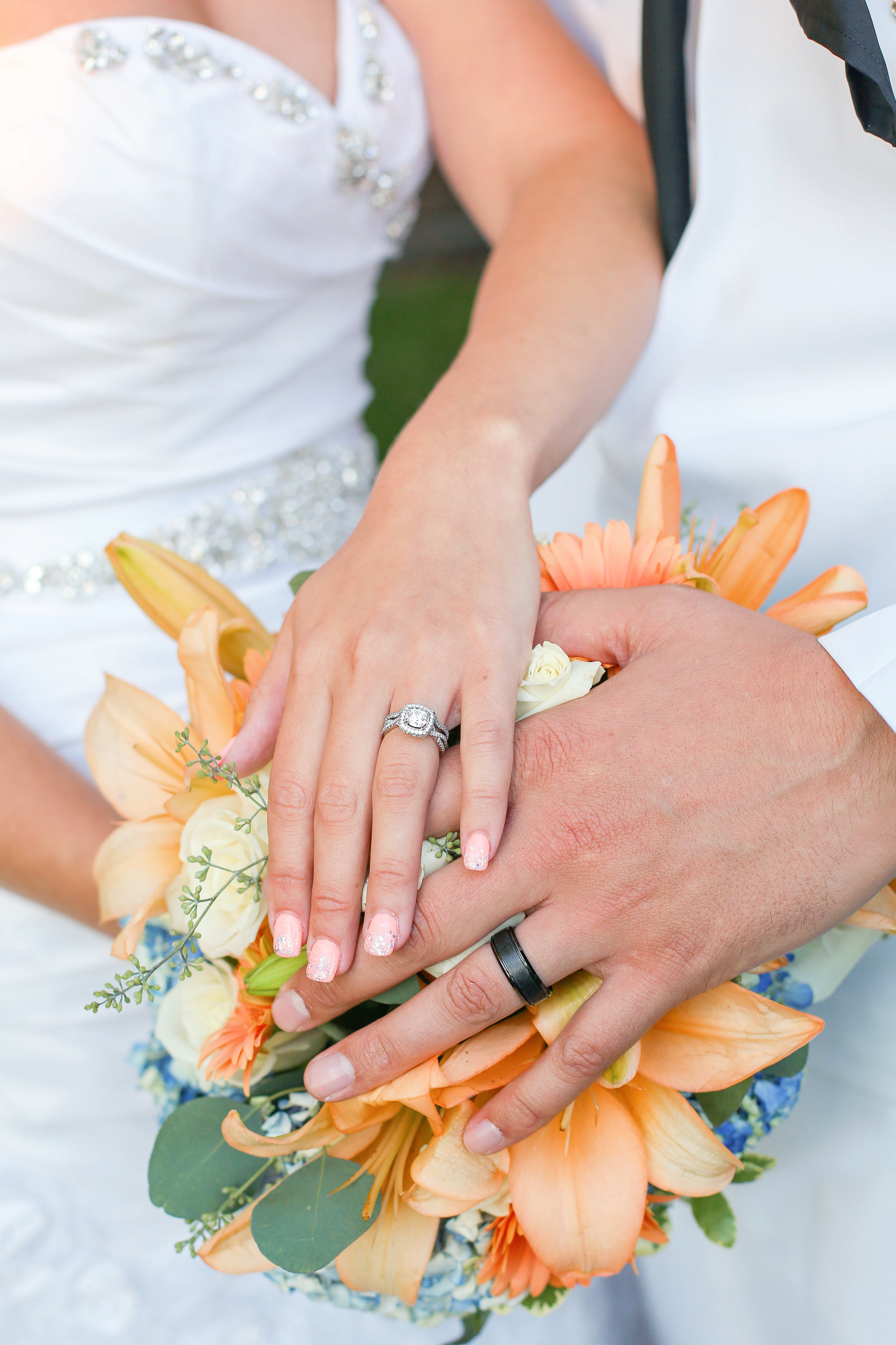His ring is from Jared Galleria of Jewelry. He wanted a black ring and it looks so cool. Her ring was made in Crown Point, IN. at Brad's Designs and Jewelry with her grandmothers diamond. So sweet! "I fell in love with the flowers on pinterest and wanted them recreated, hydrangeas were the most important because they were in our centerpieces."