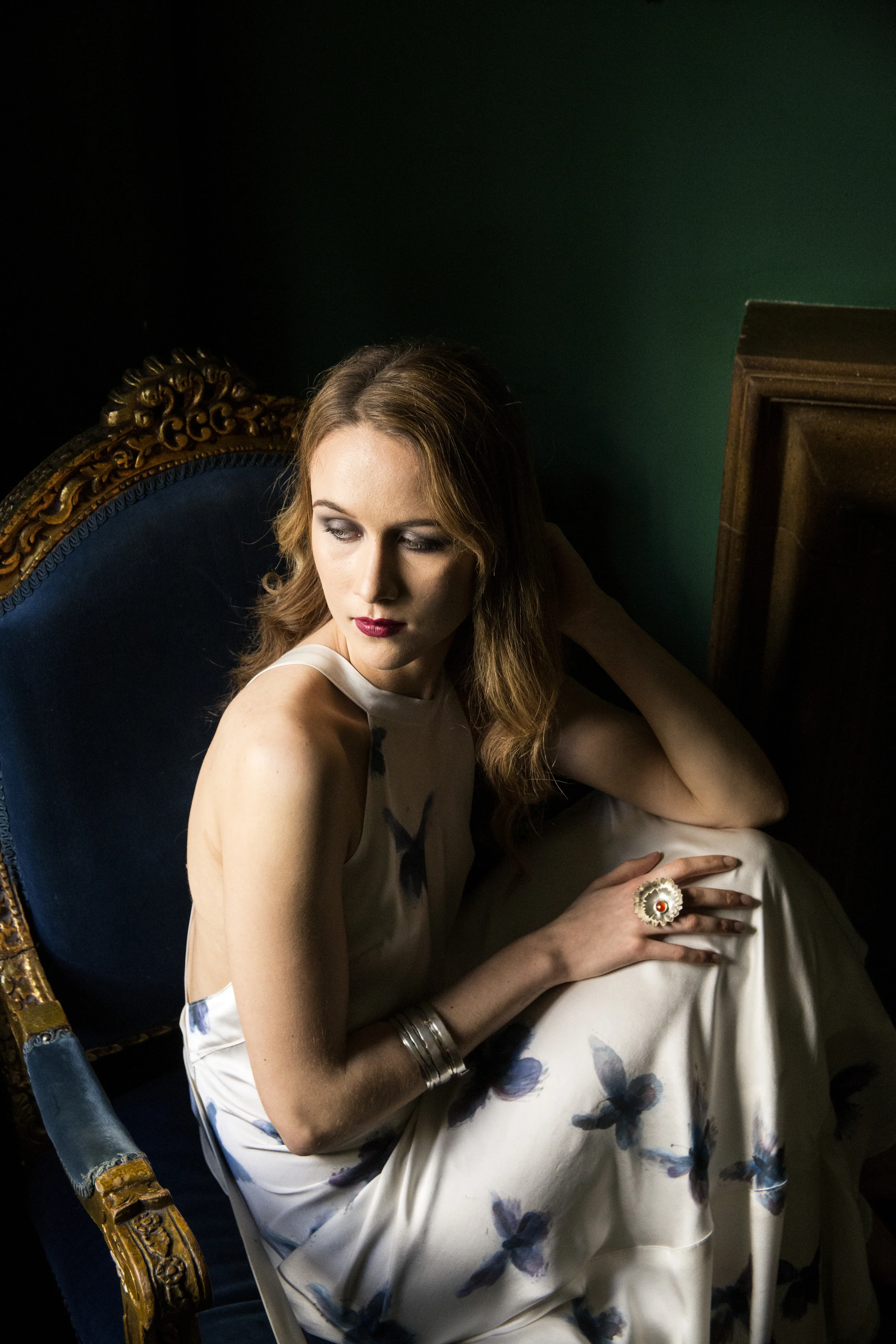 Collection of "wrapt" bangles worn with carnelian corsage ring, evening dress by Sow's Ear