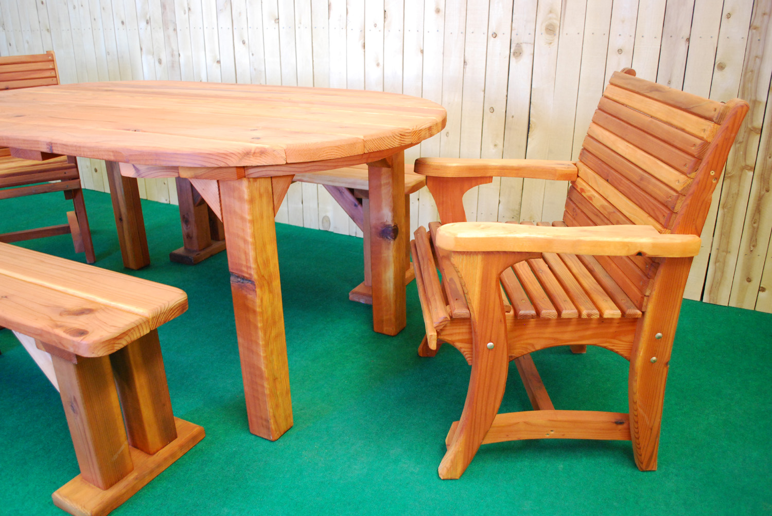 72" redwood oval picnic table shown with optional dining chairs