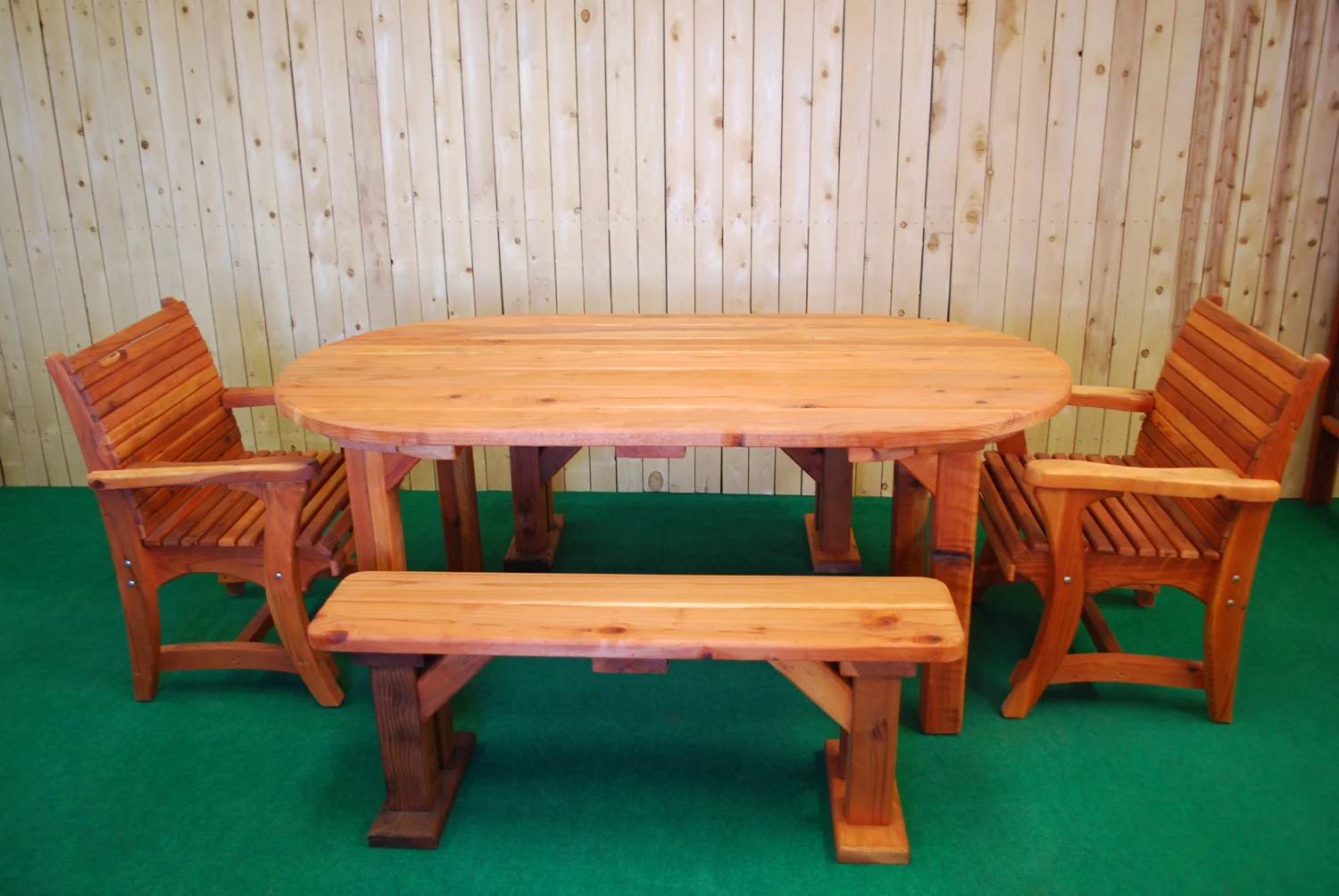 72" redwood oval picnic table shown with optional dining chairs