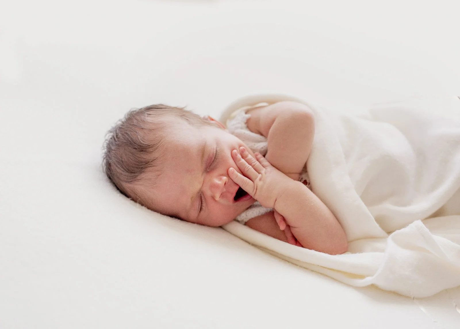 Newborn baby yawns