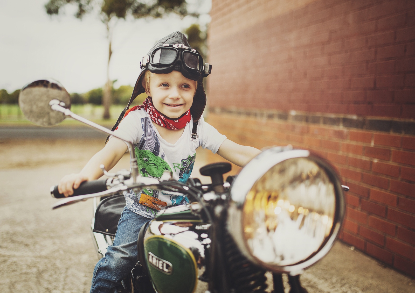 Little boy sitting on vintage motorbike!