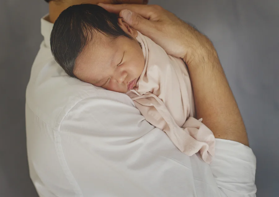Dad cuddling his newborn baby girl!