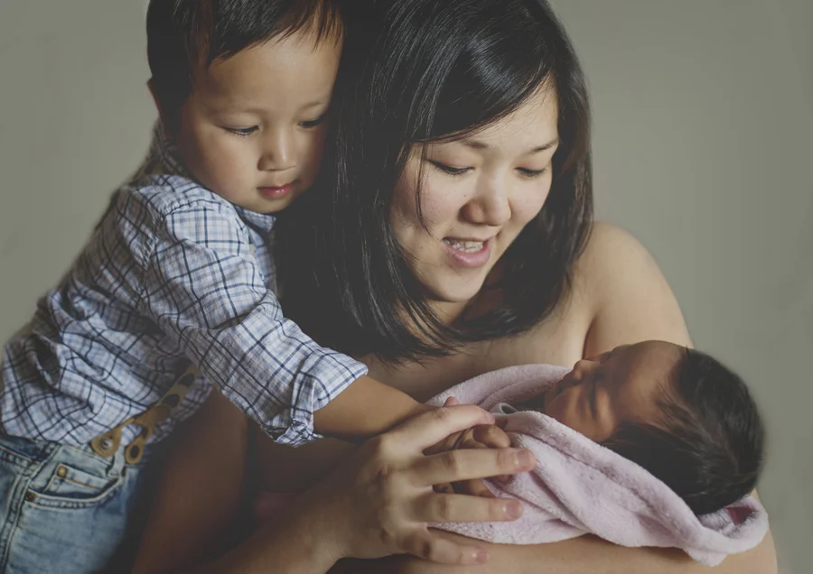 Cuddles for newborn baby sister