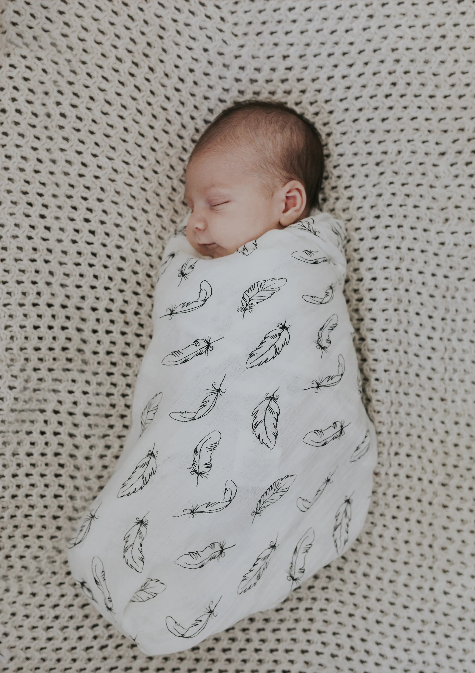 On location photo of a sleeping newborn