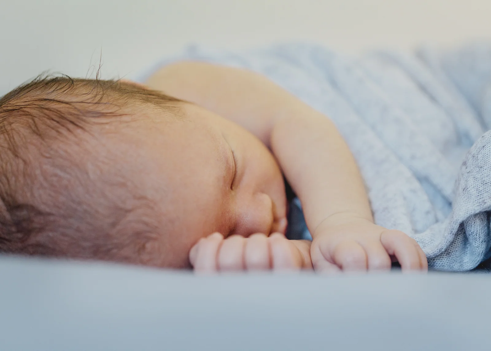Sleeping newborn baby boy