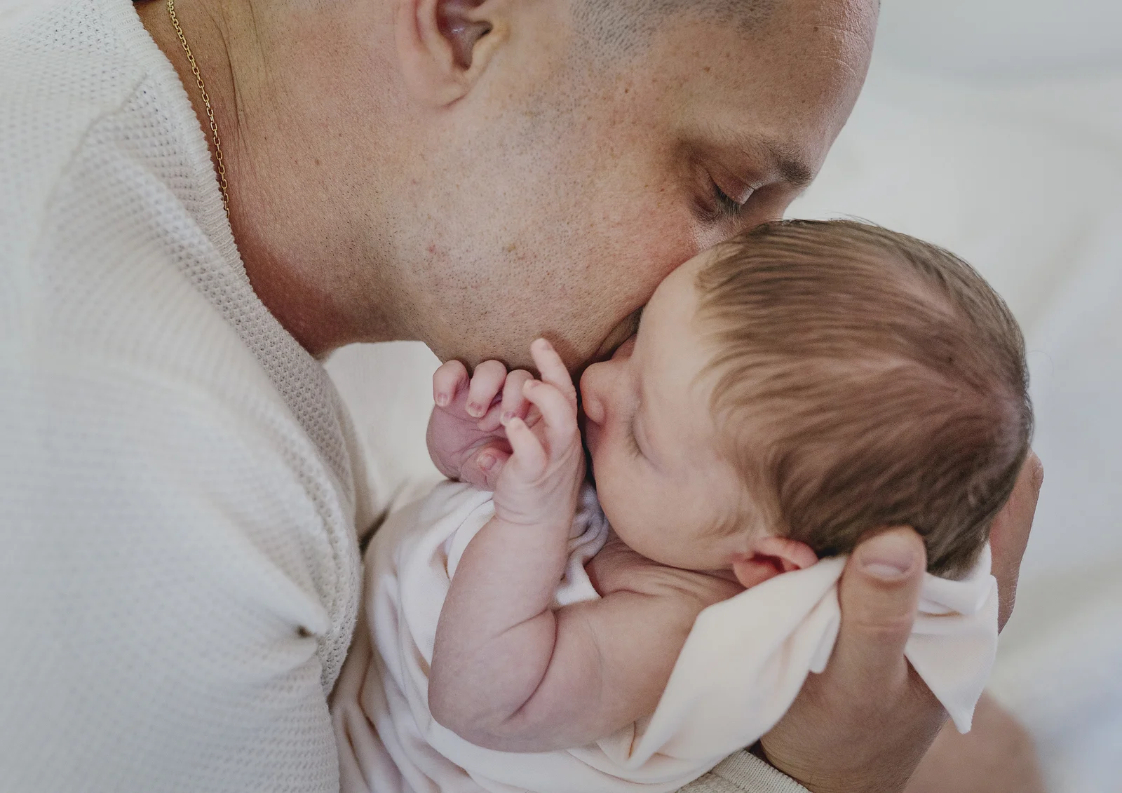 Daddy loves for his newborn baby girl