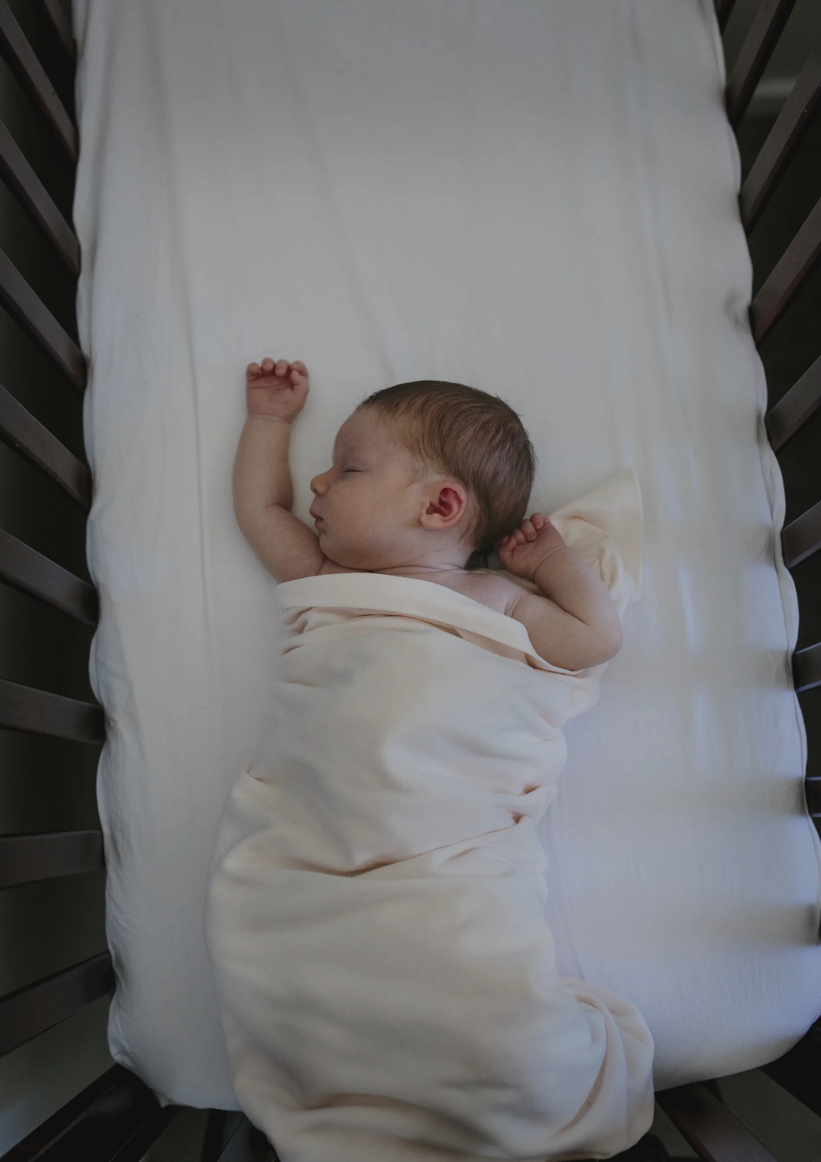 Newborn Baby Girl asleep in her cot