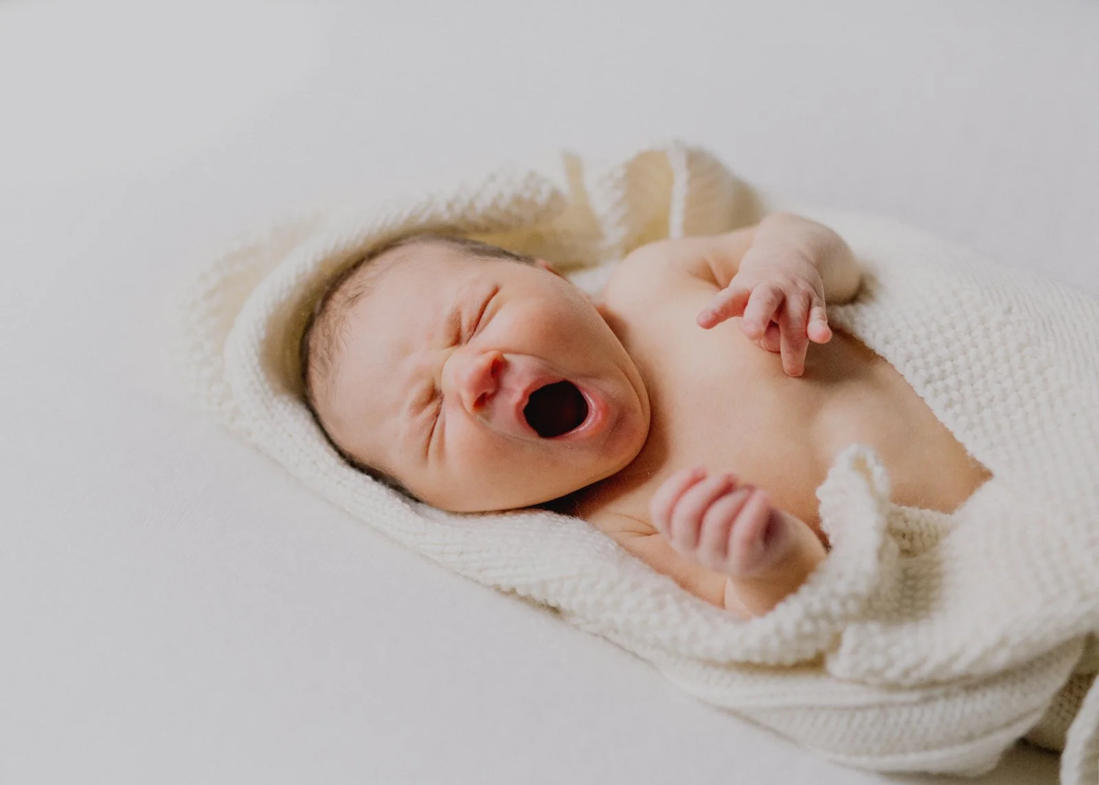 Yawning newborn baby
