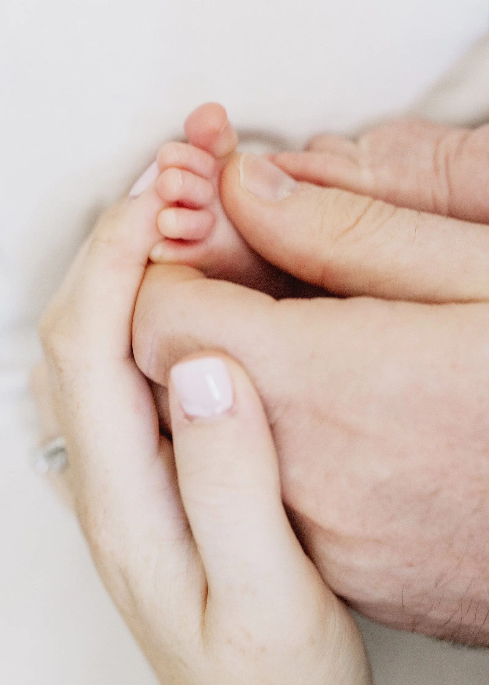 Newborn baby girl tiny foot