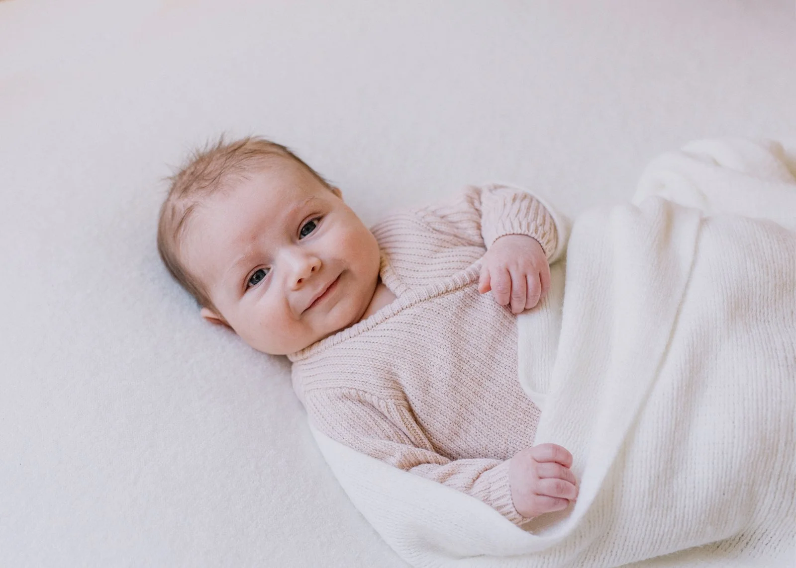 2 month old baby boy photographed in home