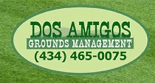 Image of Dos Amigos’ Logo in front of a beautiful lawn by Charlottesville Lawn Care along with Christian's Lawn Care.