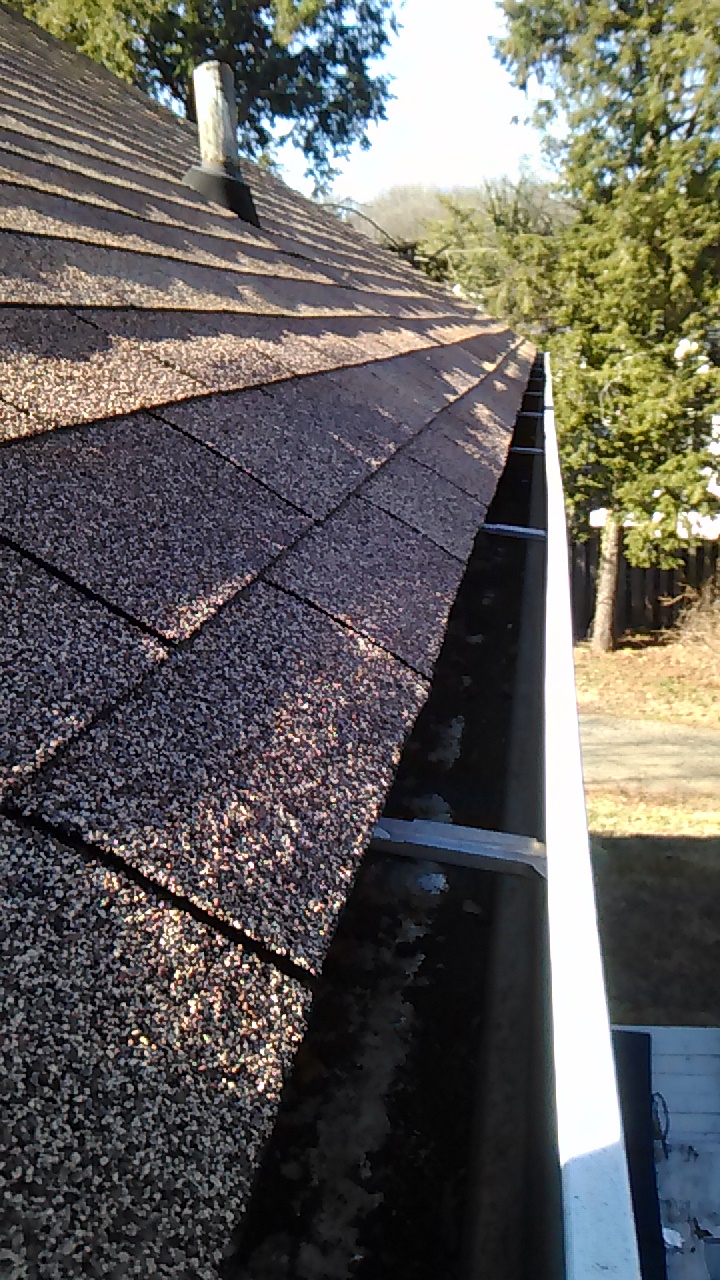 Image of a clean gutter after Charlottesville Lawn Care crews inspected and cleaned the gutter from the roof