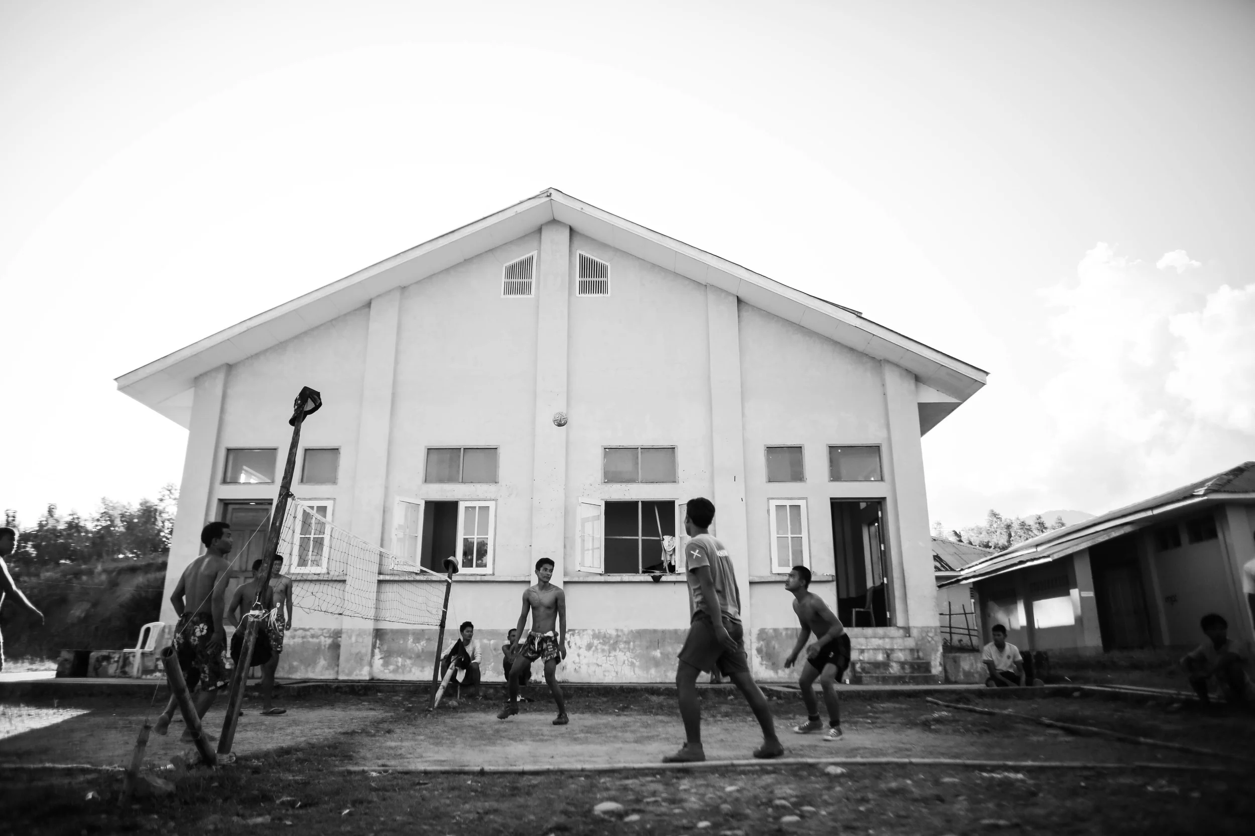 Recovering addicts at the Aung Mintha play a game called "chinlone" or cane ball in the evenings to pass time and become fit.
