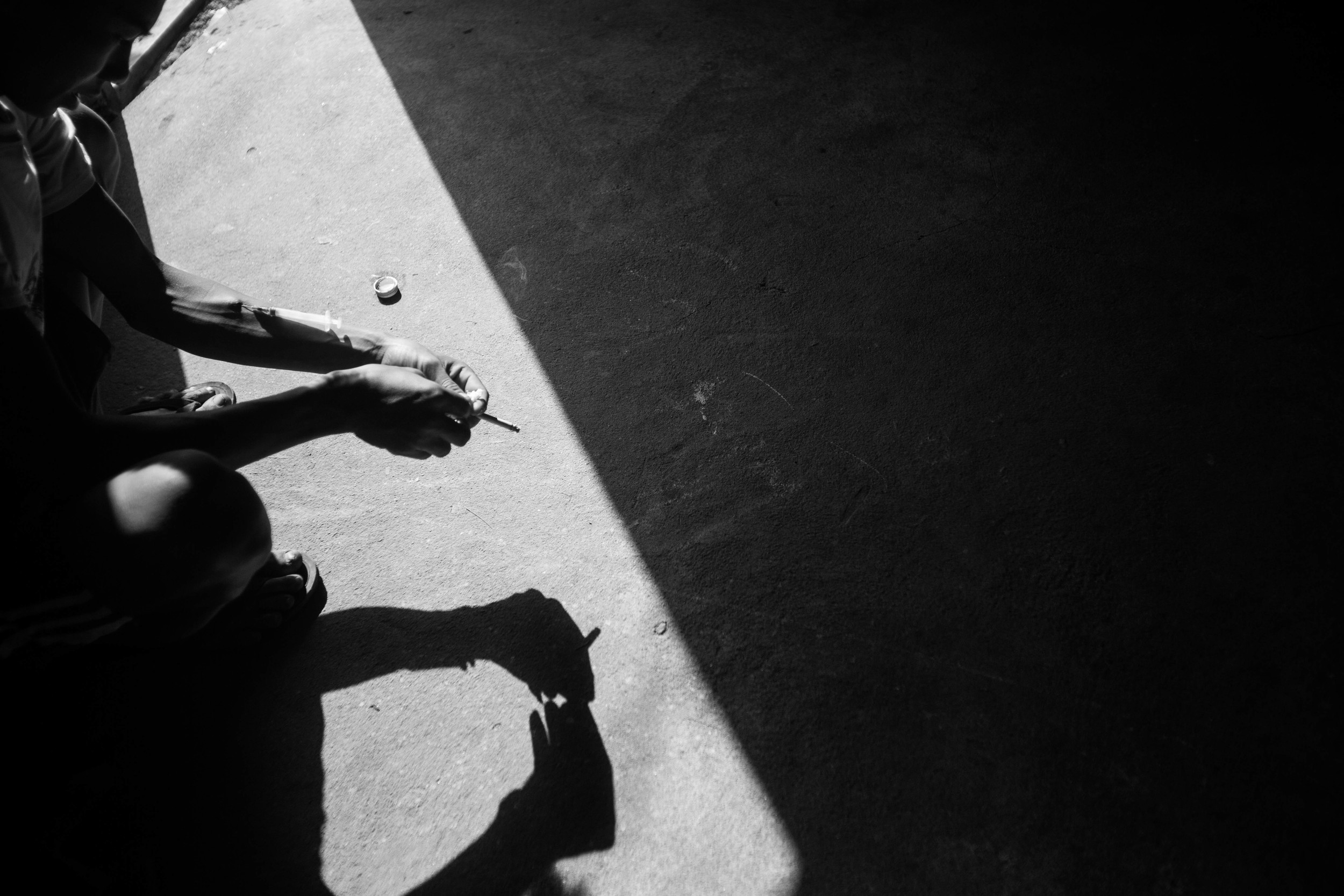 "Ah Tu", 21, has been recruited to join a rehab center and promises to go the next day. But first he takes this last hit. He has been an addict for three to four years. While he was recruited by a private Christian center, he told the recruiter that he's decided to go to the government clinic instead because they have methadone. Most Kachin addicts choose not to go to the government-run clinic because of their distrust of the government. The Kachin and the central Myanmar government are still at war.