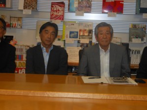 Shiro Tsukada, President of Nishiki Akira Printing Co. Ltd discusses details of the world's first LED-UV installation on a high speed web offset machine during a news conference in July with AJC (Air Motion Systems, Japan) President, Mamoru Seki.
