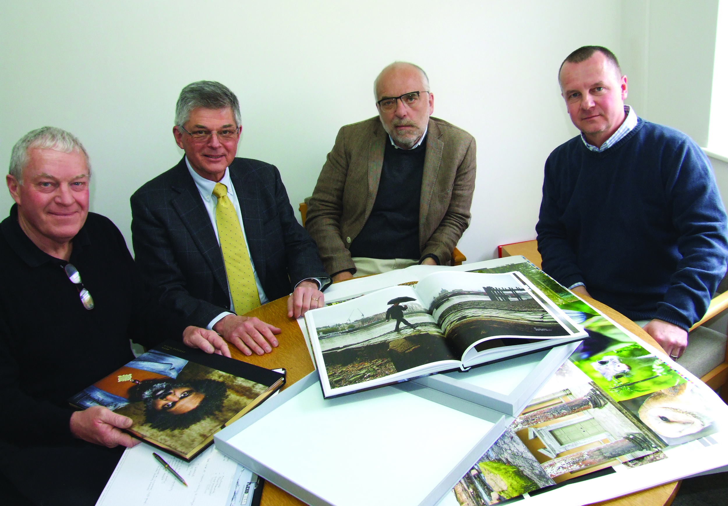 From Left: Jim Lunt (Opal Print Director), Claus Nielsen (AMS UK), Carsten Barlebo (AMS European MD) and Keith Lunt (Opal Print MD) with The South Bank Tower book featuring photography by Steve McCurry.