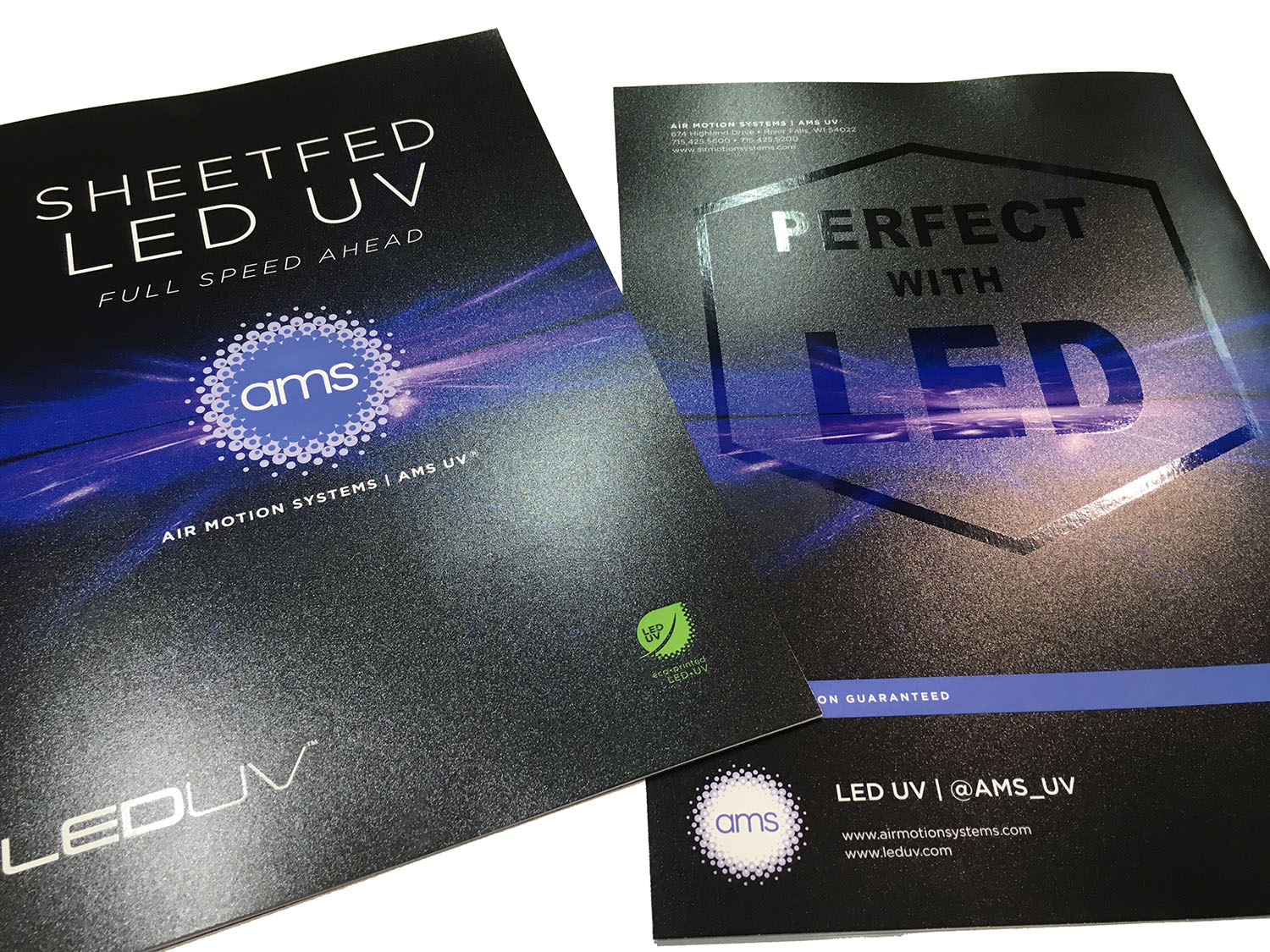 AMS will be showcasing numerous examples of 100% LED Drip-Off (Strike-through) coating effects at drupa 2016. Shown above are printed front and back covers of the new AMS Sheetfed LED UV brochure. The Drip-Off coating provides an extreme, visible and tactile contrast between high gloss and matte areas on the sheet. 