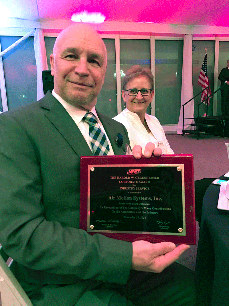 Shown above, AMS lead field technician Pierre Gelinas proudly displays the award with colleague Sue Williams looking on. During his acceptance speech, AMS president Steve Metcalf recognized the incredible dedication of Michel Gelinas, Pierre's brother who passed away earlier this year, noting he perfectly exhibited the qualities that this award serves to honor.