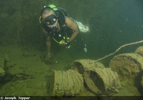 Japanese helmets and other supplies are all that's left on the accurately nicknamed "Helmet Wreck"