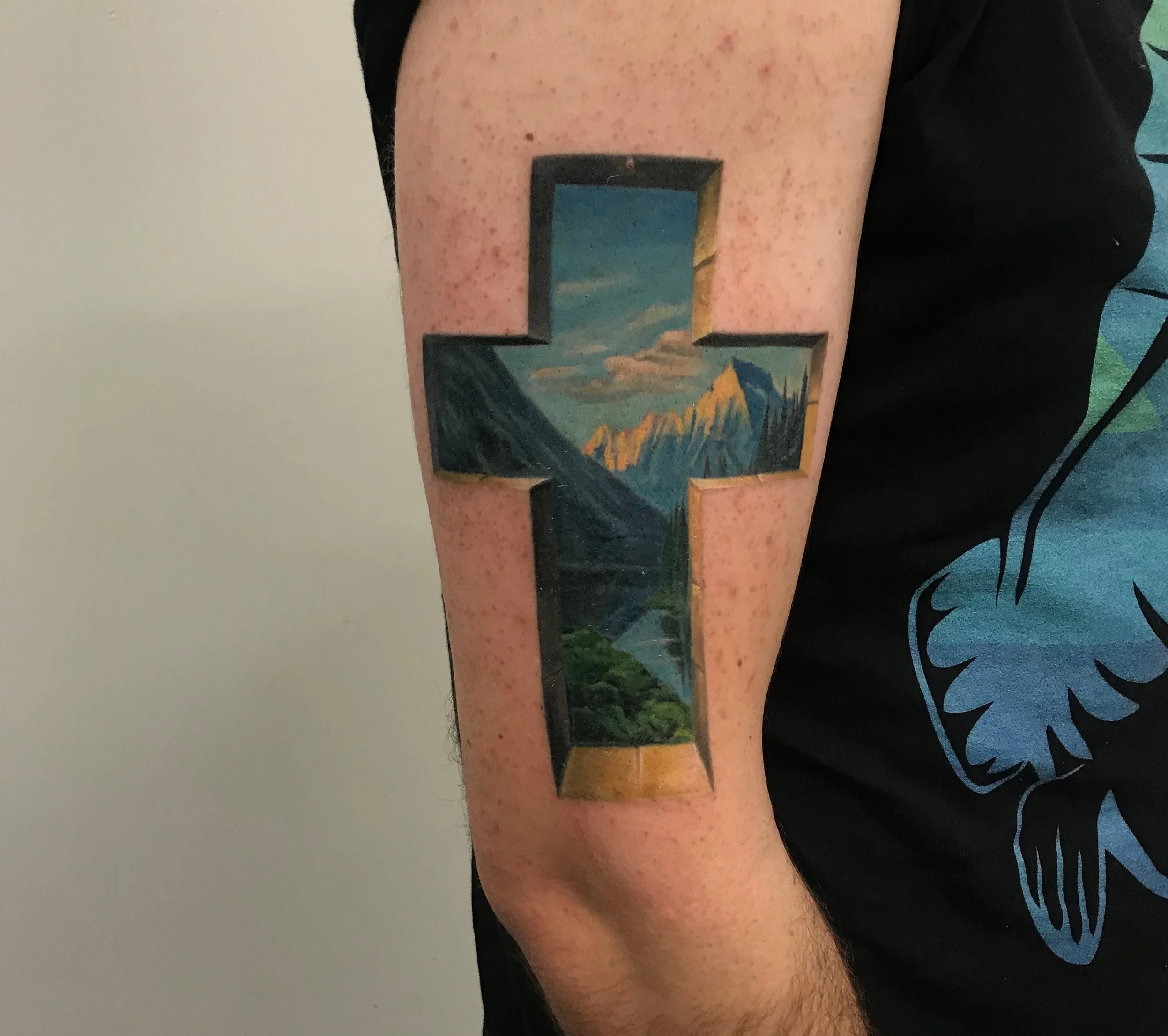 140-mountain-landscape-cross-window-color-arm-tattoo-nyc.jpg