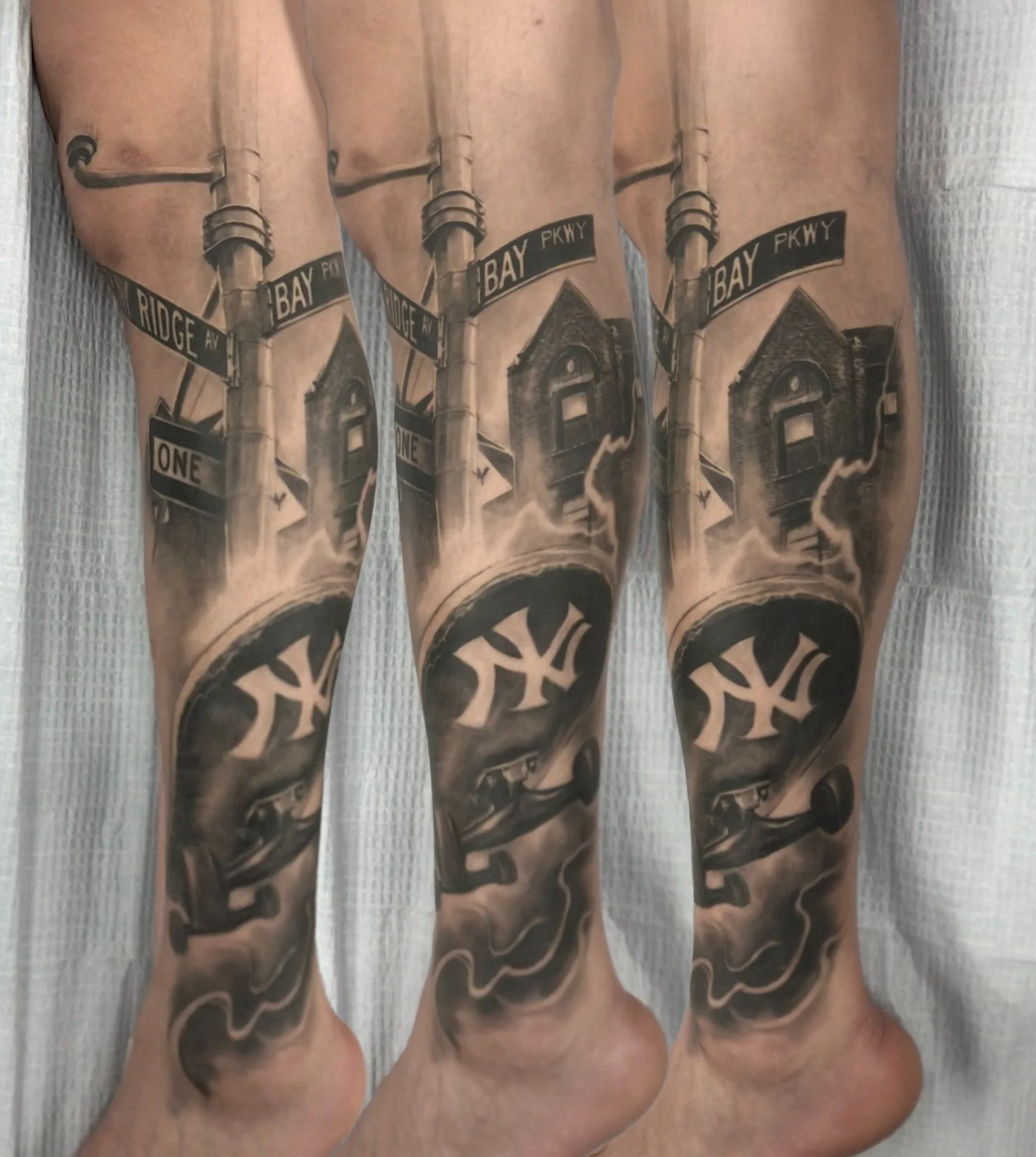 Black and grey NYC realism leg tattoo featuring Bay Parkway, Yankees imagery, street signs, and skateboard-inspired details.