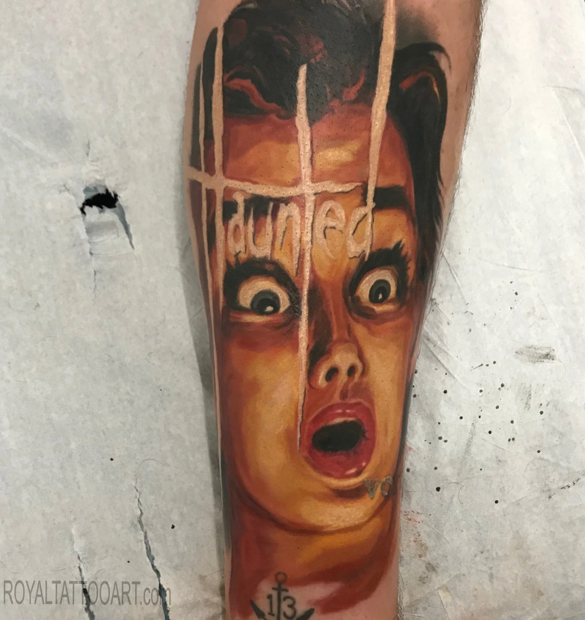 Eerie haunted book cover horror portrait tattoo in photorealistic style, done in NYC. Royal Tattoo Art captures the dark drama and cinematic detail of a classic horror aesthetic, making this a standout piece for fans of dark art and gothic tattoos.