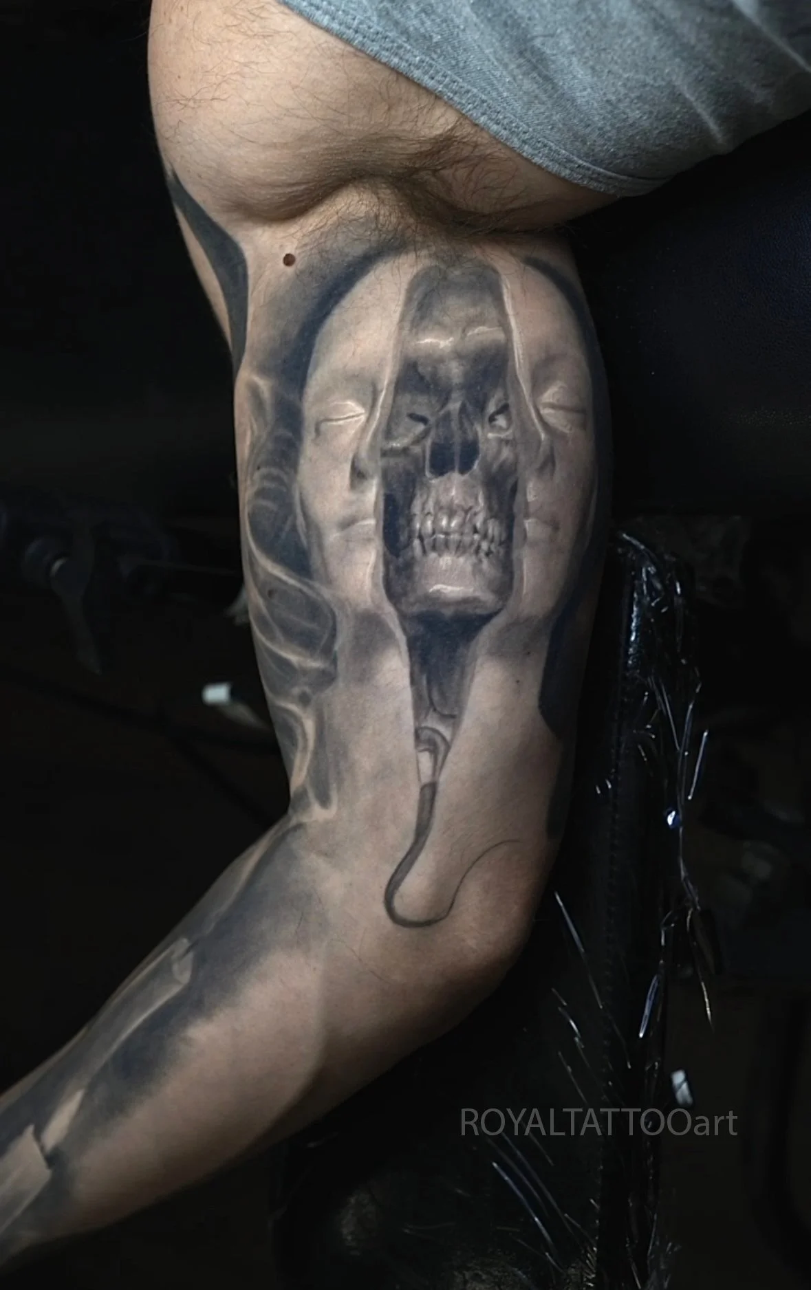 Black and grey skull realism tattoo with detailed shading, strong contrast, and a clean realistic finish by Royal Jafarov in NYC.