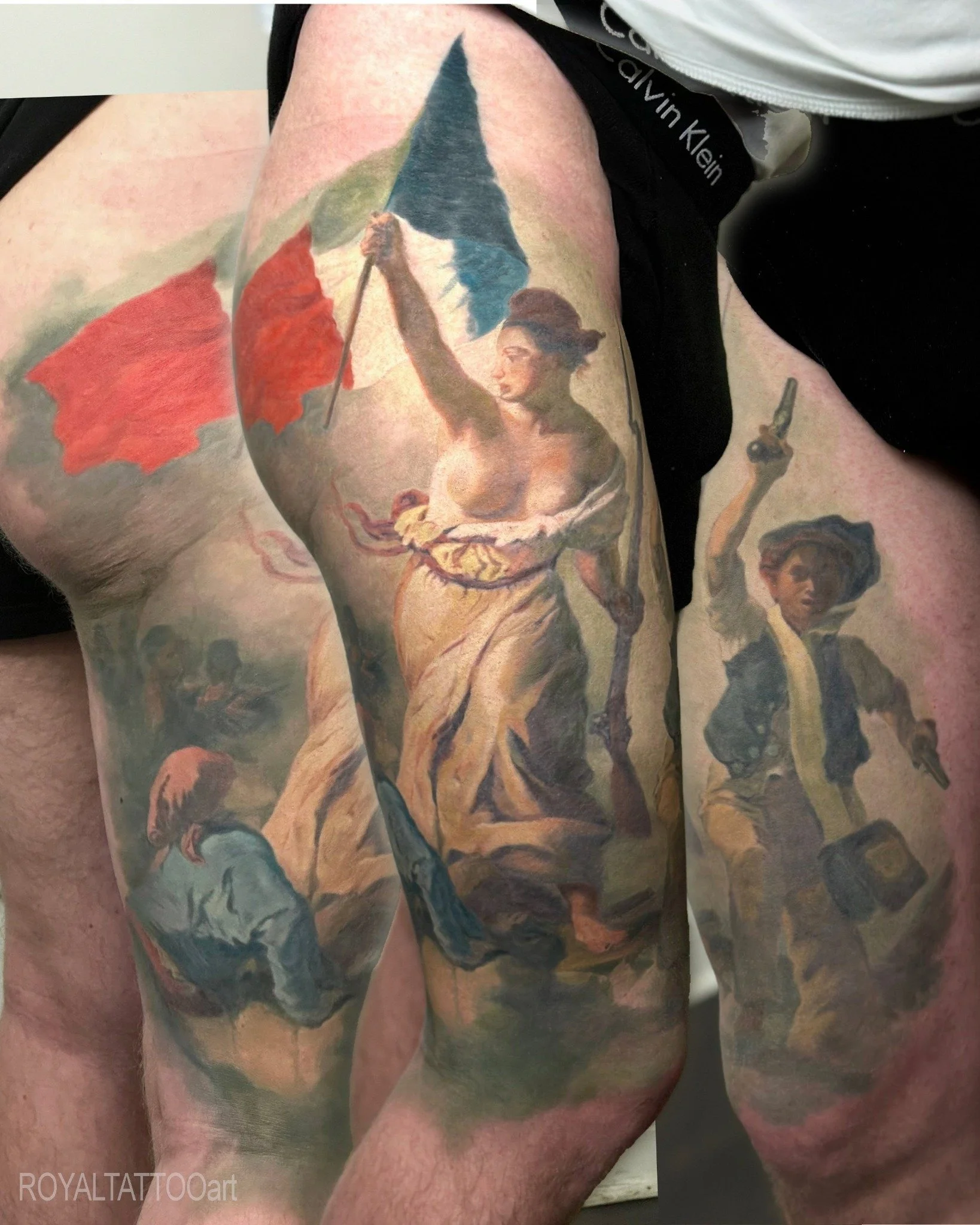 Delacroix's 'Liberty Leading the People' fine art realism tattoo in NYC. Royal Tattoo Art masterfully recreates this iconic French Romantic masterpiece on skin, capturing its revolutionary energy and dramatic composition in breathtaking color realism