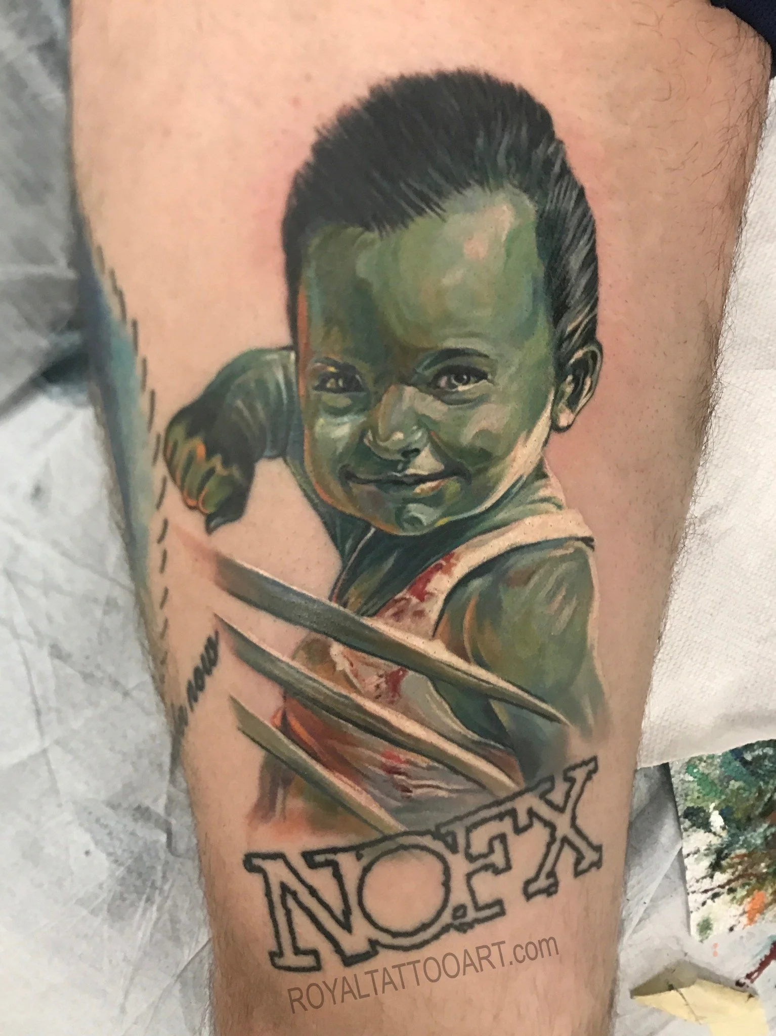 Incredible Hulk comic portrait tattoo in vibrant color realism, tattooed in NYC. Royal Tattoo Art brings the iconic Marvel character to life with explosive color and dynamic composition, perfect for comic book fans seeking a bold, lifelike tattoo tri