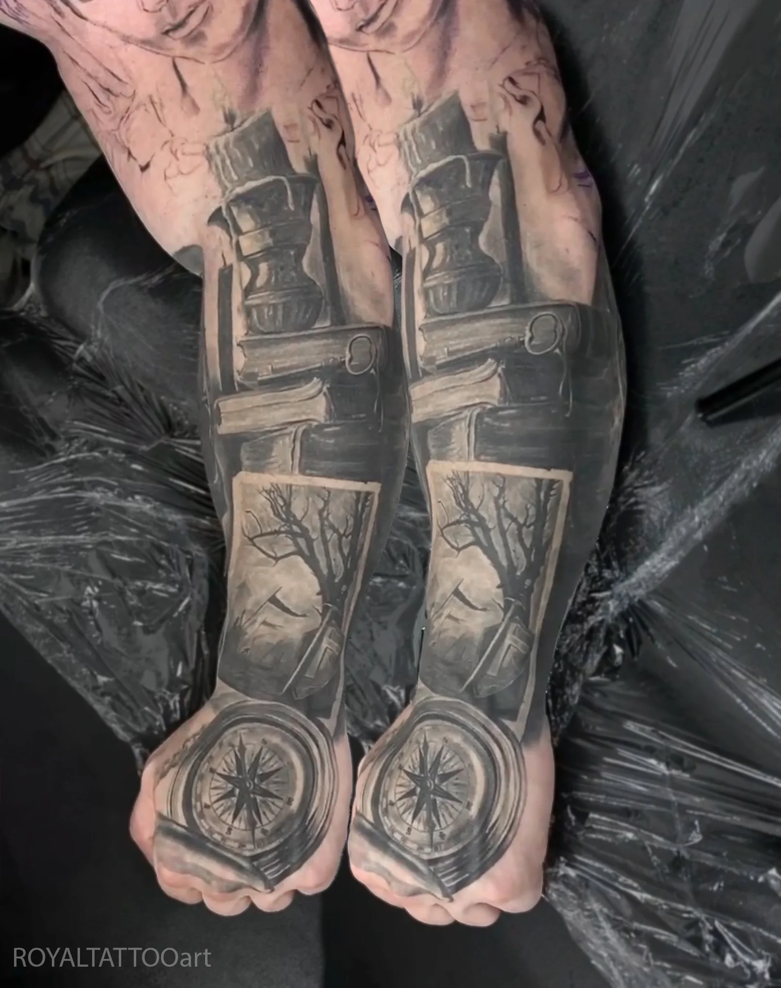 Black and grey religious realism sleeve tattoo featuring detailed spiritual imagery, custom composed by Royal Jafarov on Bowery in NYC.
