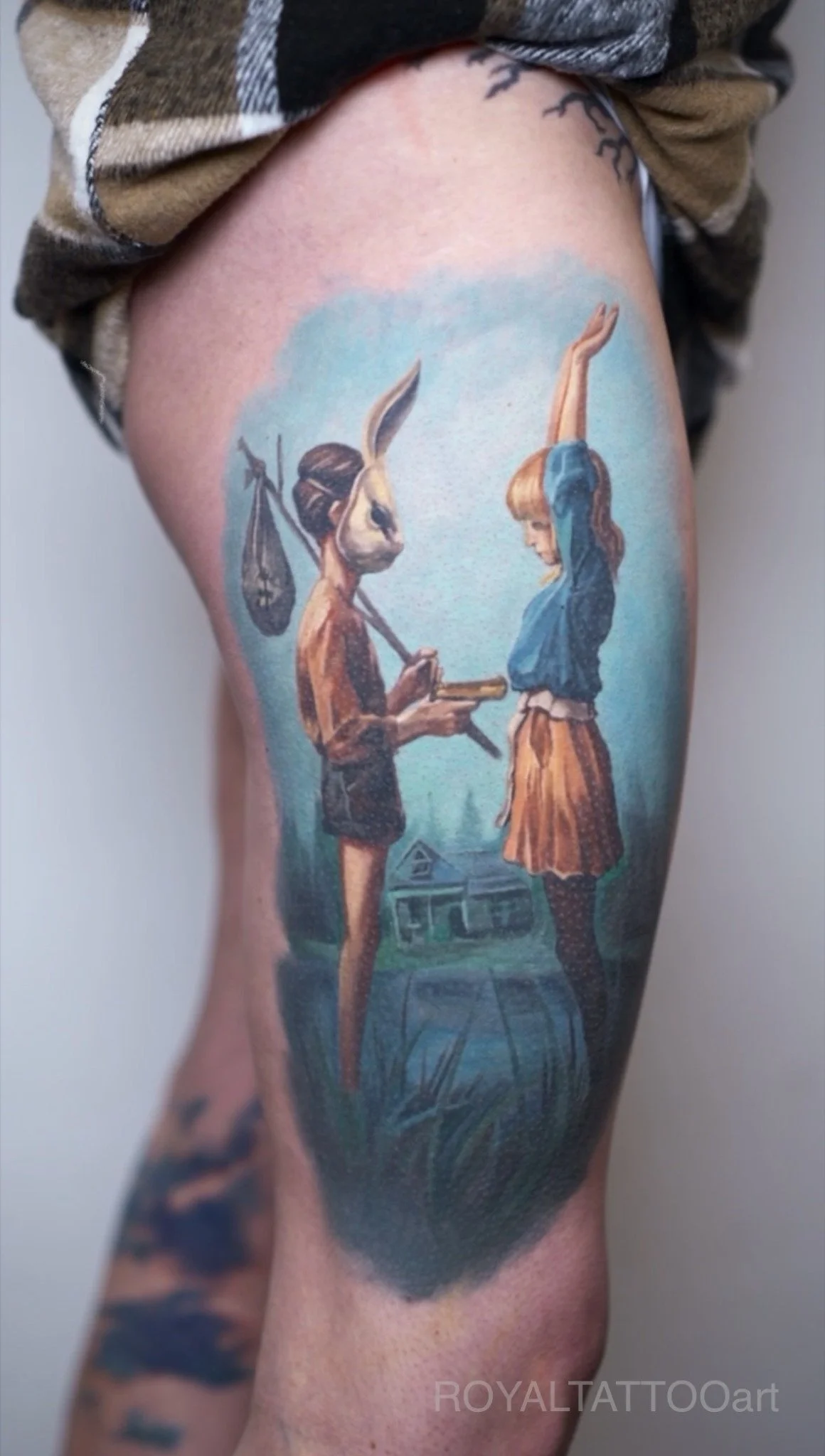Whimsical storybook-inspired color realism leg tattoo created in NYC. Royal Tattoo Art brings a fairytale narrative scene to life with rich color realism, making this an imaginative and highly detailed fine art leg tattoo for storytelling enthusiasts