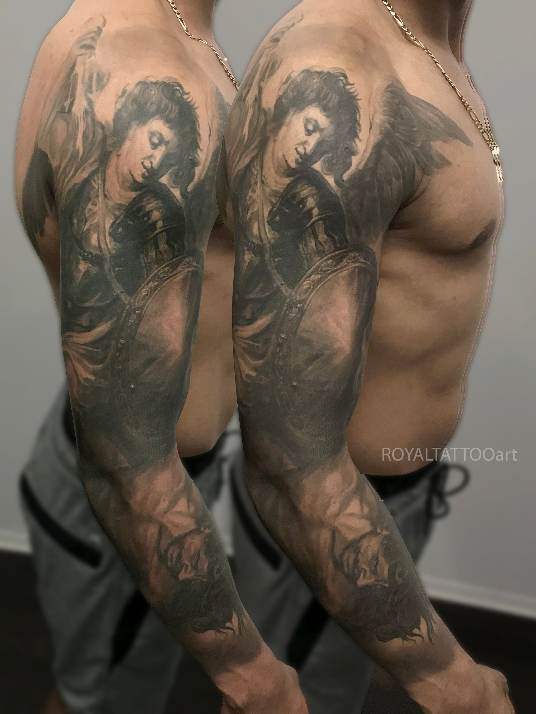 Black and grey St. Michael the Archangel realism tattoo, featuring religious symbolism, dramatic shading, and detailed angelic imagery.
