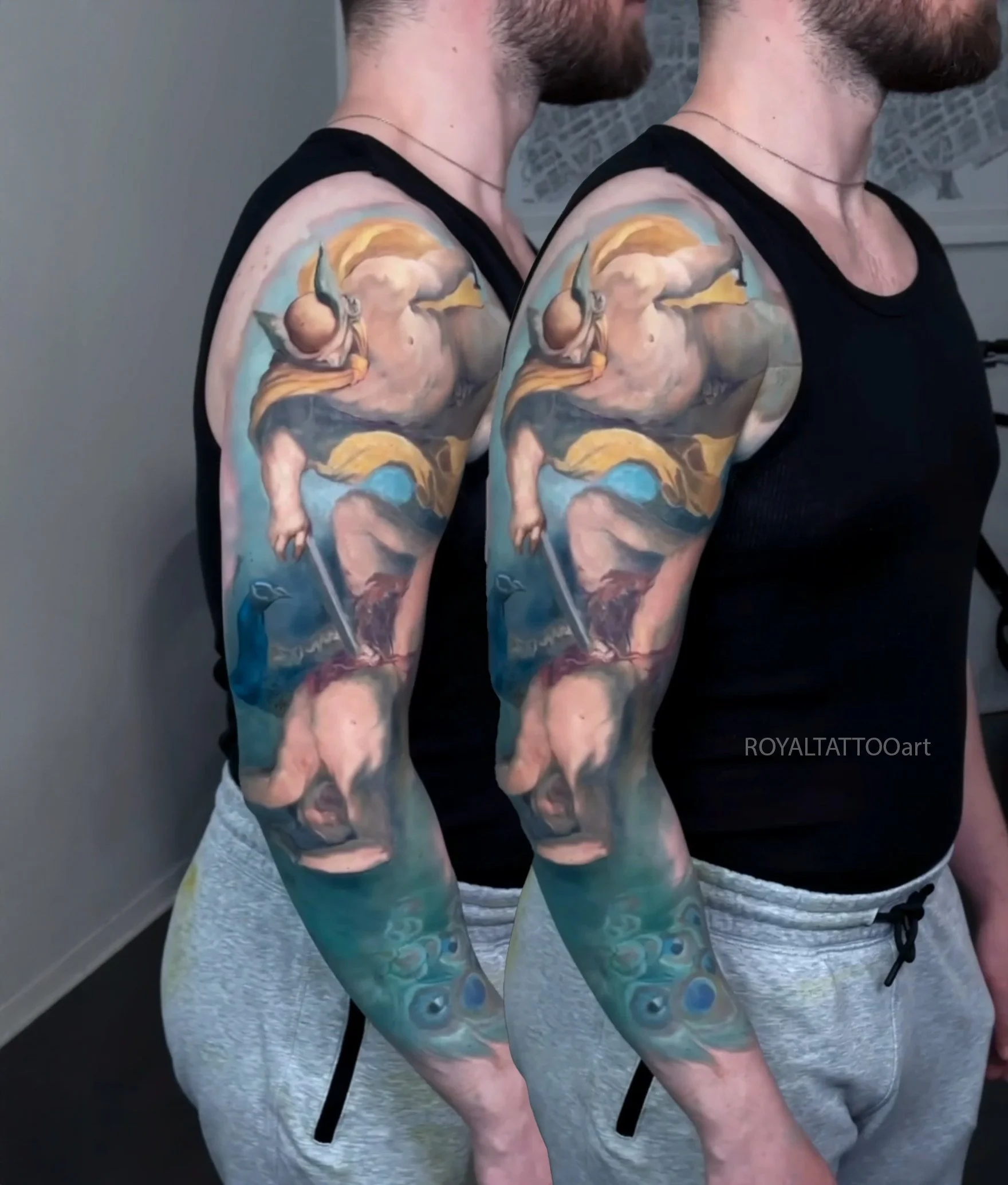 Intricate fine art realism tattoo featuring classical mythology and figure compositions on the arm, done at Royal Tattoo Art NYC. This exceptional piece merges the elegance of Old Masters painting with modern tattoo artistry in vivid color realism.