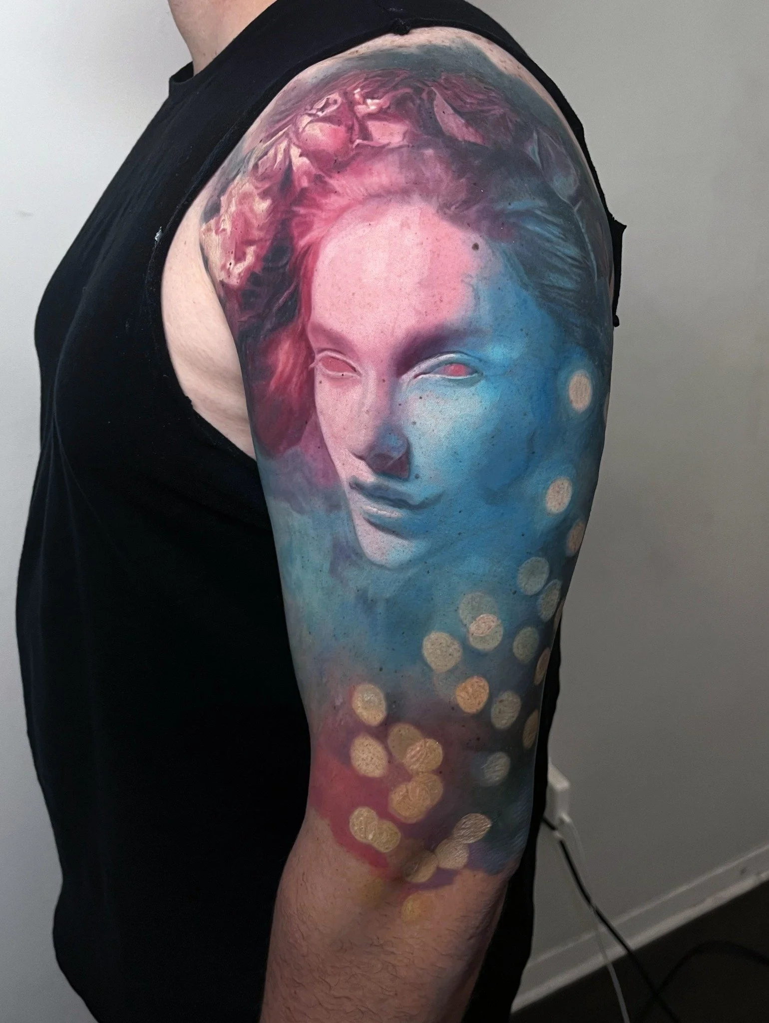A surreal female portrait blending realistic features with imaginative watercolor textures across the arm.