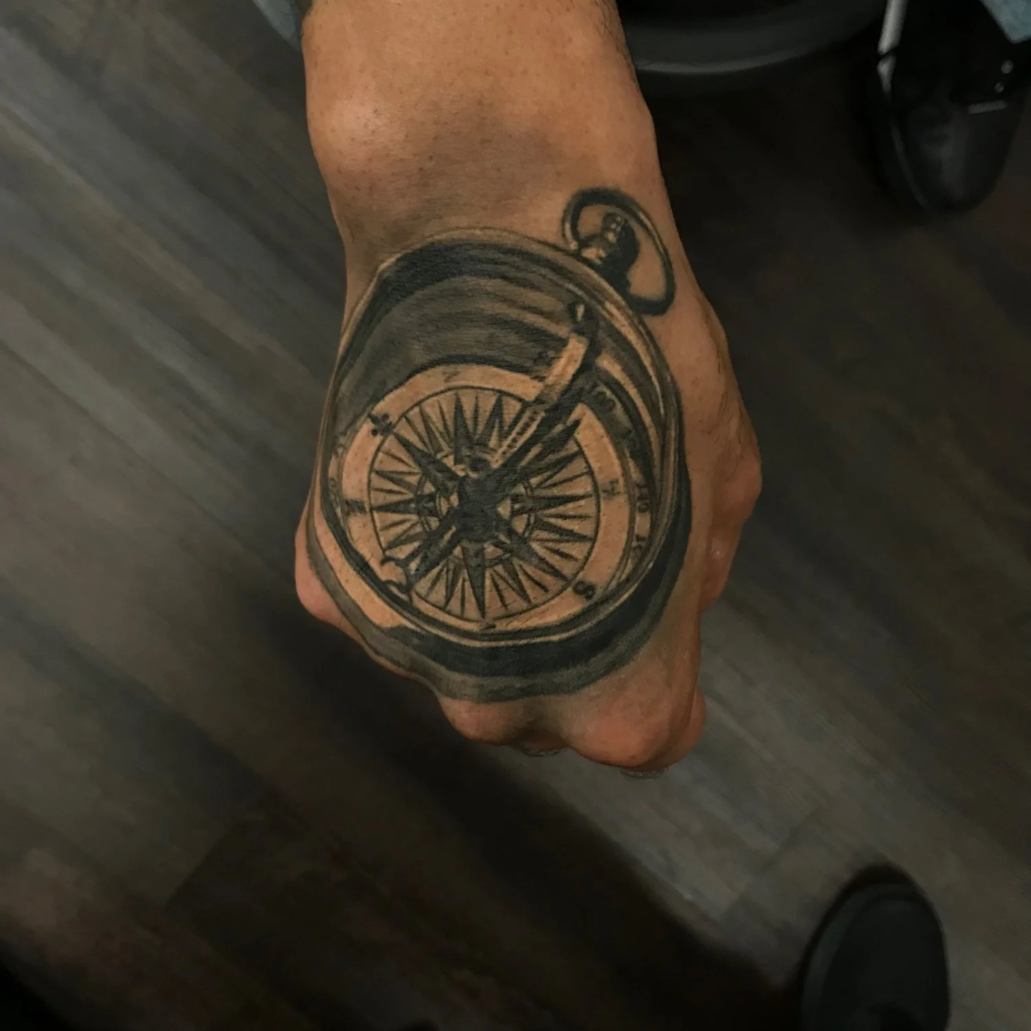 61-compass-hand-tattoo-black-and-grey-realism-nyc.jpg