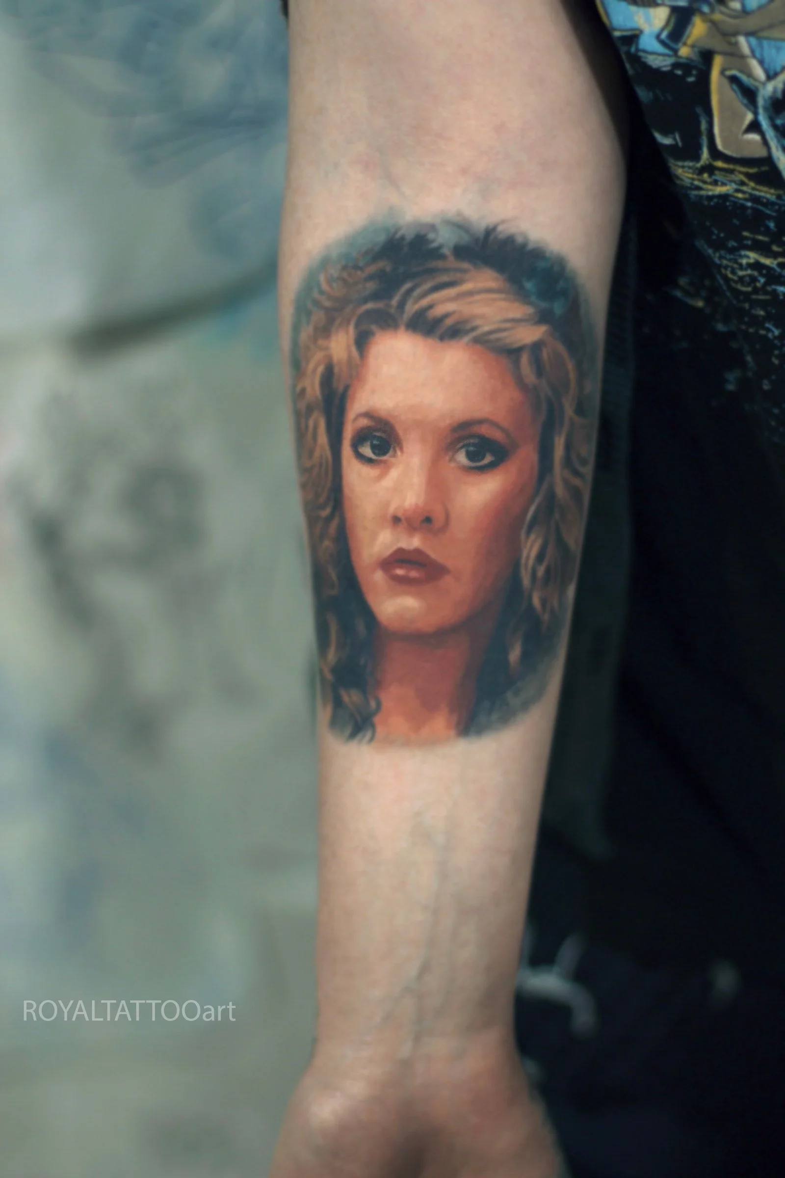 A realistic portrait of a woman rendered in color realism, emphasizing delicate shading and lifelike details on the forearm.