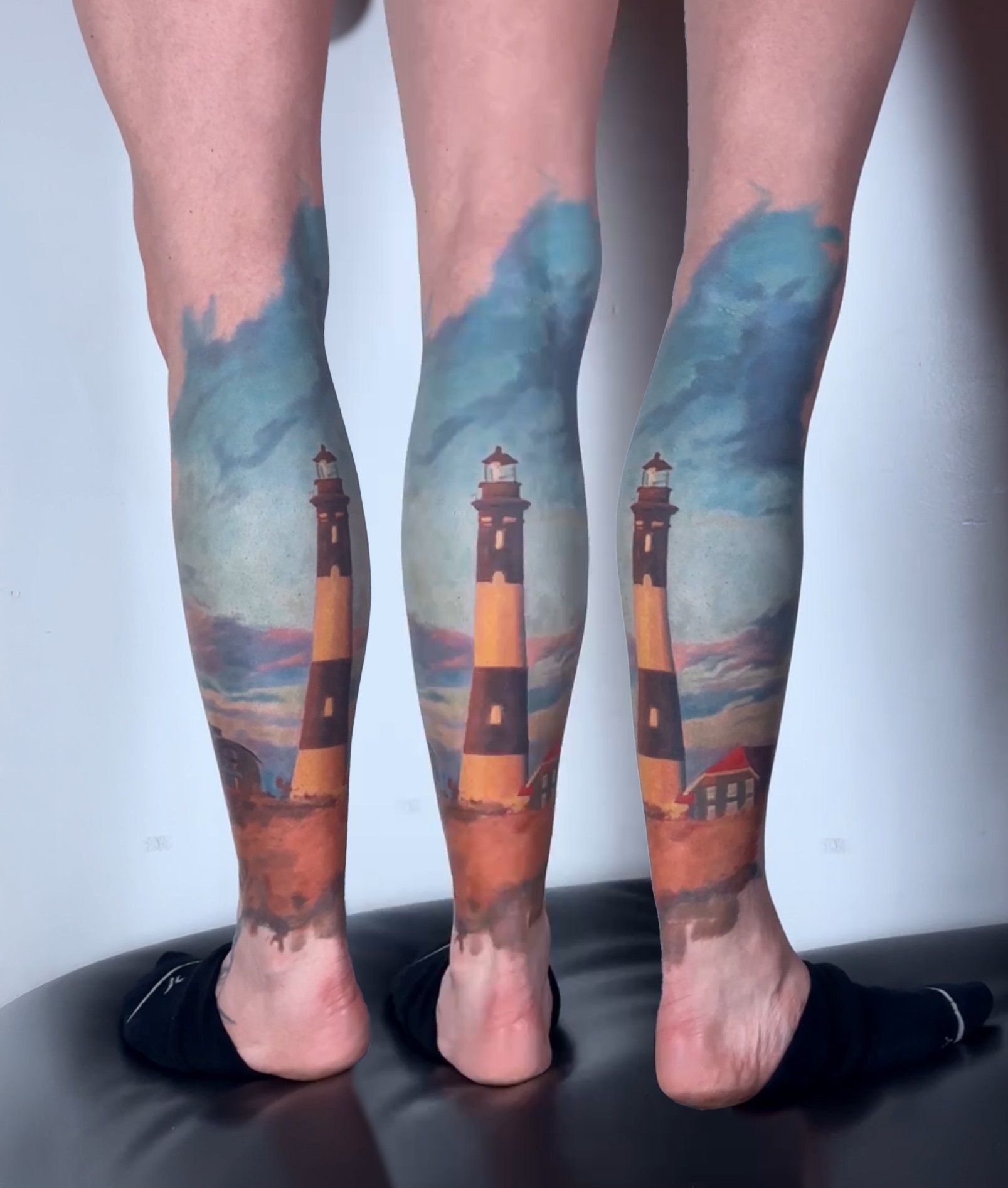 A pair of lighthouses depicted in realistic detail on the calves, capturing iconic coastal beacons and seascape.