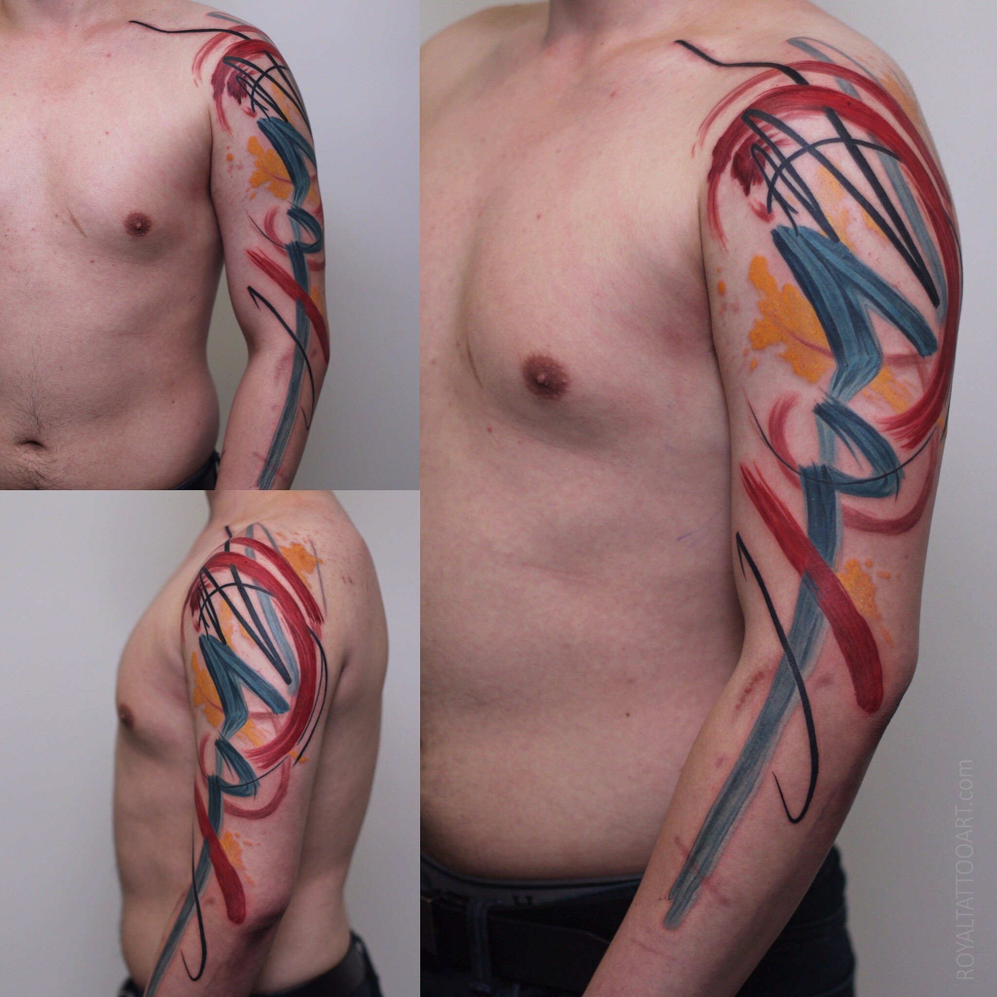 Abstract watercolor tattoo with red and blue calligraphy brushstrokes on male torso and arm, expressive ink design by Royal Jafarov at Royal Tattoo Art
