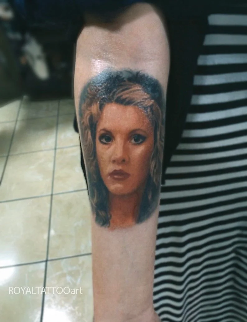 Color realism Stevie Nicks portrait tattoo on the forearm, capturing her iconic look with soft shading and lifelike color by Royal Jafarov in NYC.