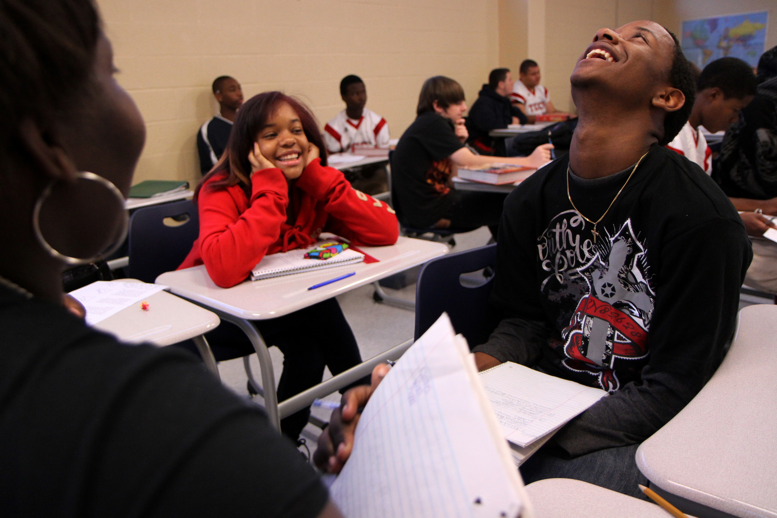  Tigner and his classmates laugh during economics class while discussing what material things are worth buying after inflation. Their wants and needs don't seem to match up. 